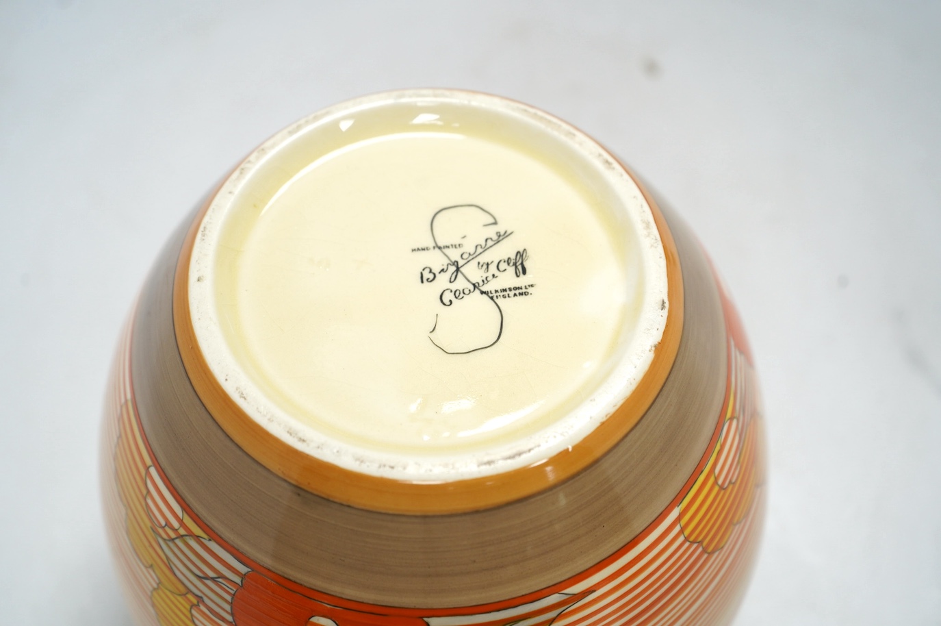 A Clarice Cliff Bizarre vase, Capri pattern,17cm high. Condition - fair to good